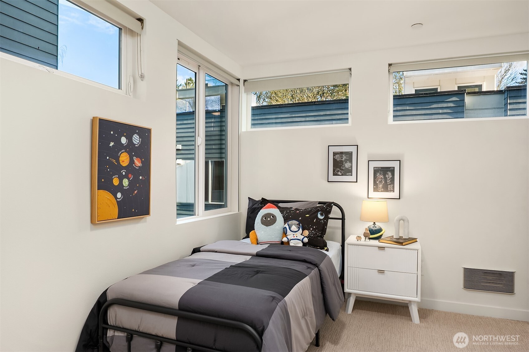 2617 3rd Avenue West Seattle, WA 98119 - Photo 22 of 30 a bedroom with a bed and a window