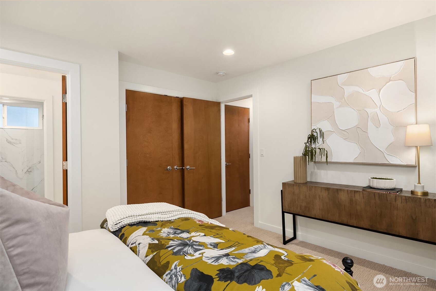 2617 3rd Avenue West Seattle, WA 98119 - Photo 23 of 30 a bedroom with a bed and a painting on the wall