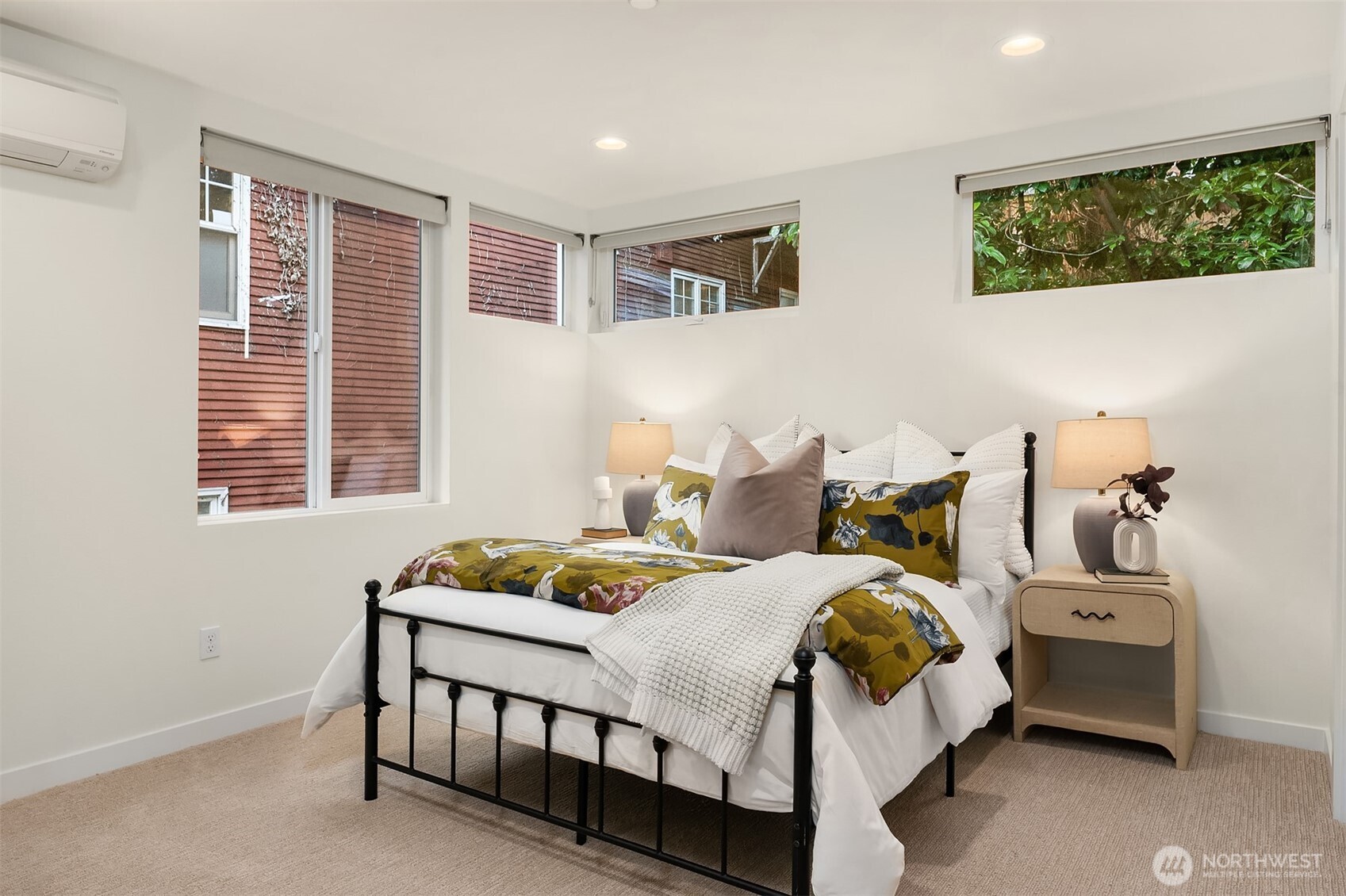2617 3rd Avenue West Seattle, WA 98119 - Photo 24 of 30 a bedroom with a bed and a window