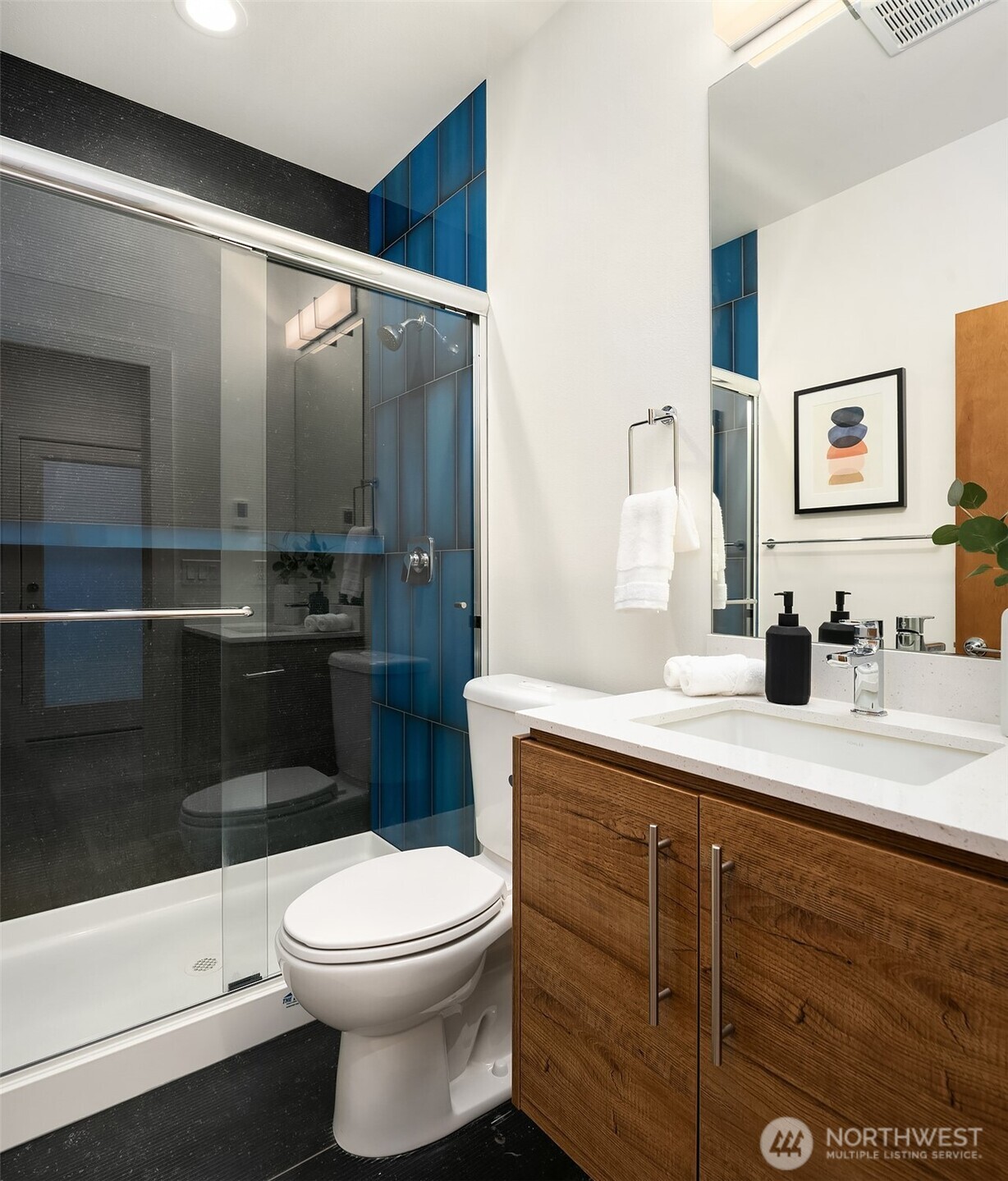 2617 3rd Avenue West Seattle, WA 98119 - Photo 4 of 30 a bathroom with a sink a toilet and shower