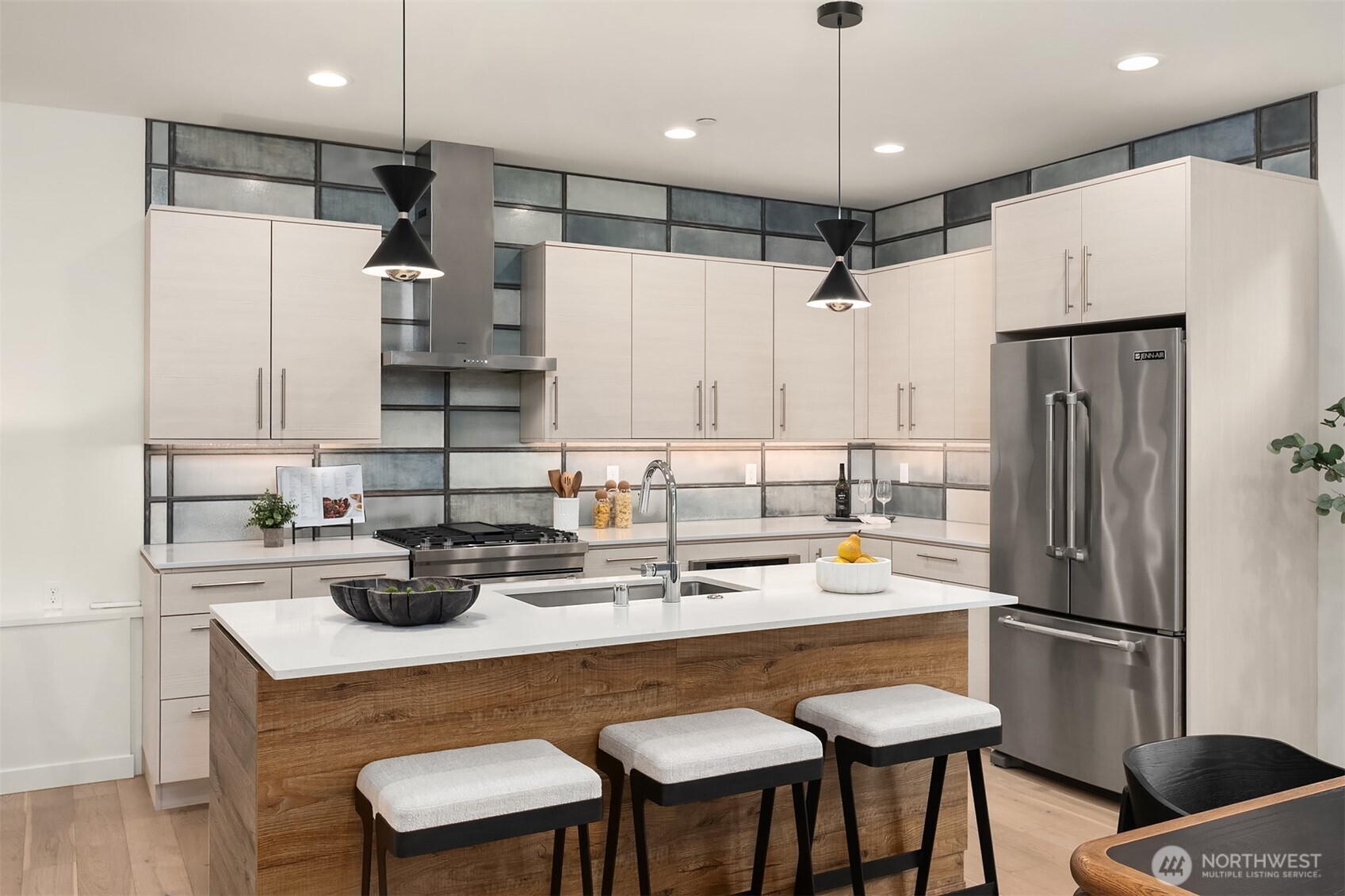 2617 3rd Avenue West Seattle, WA 98119 - Photo 7 of 30 a kitchen with refrigerator a sink and chairs