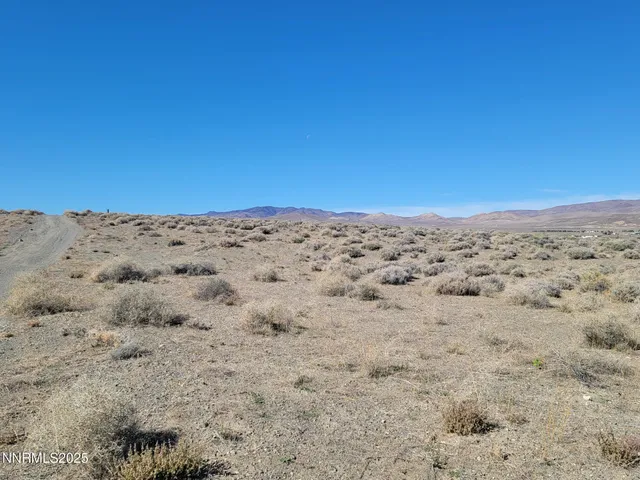 a view of sand dunes and covered with sky view