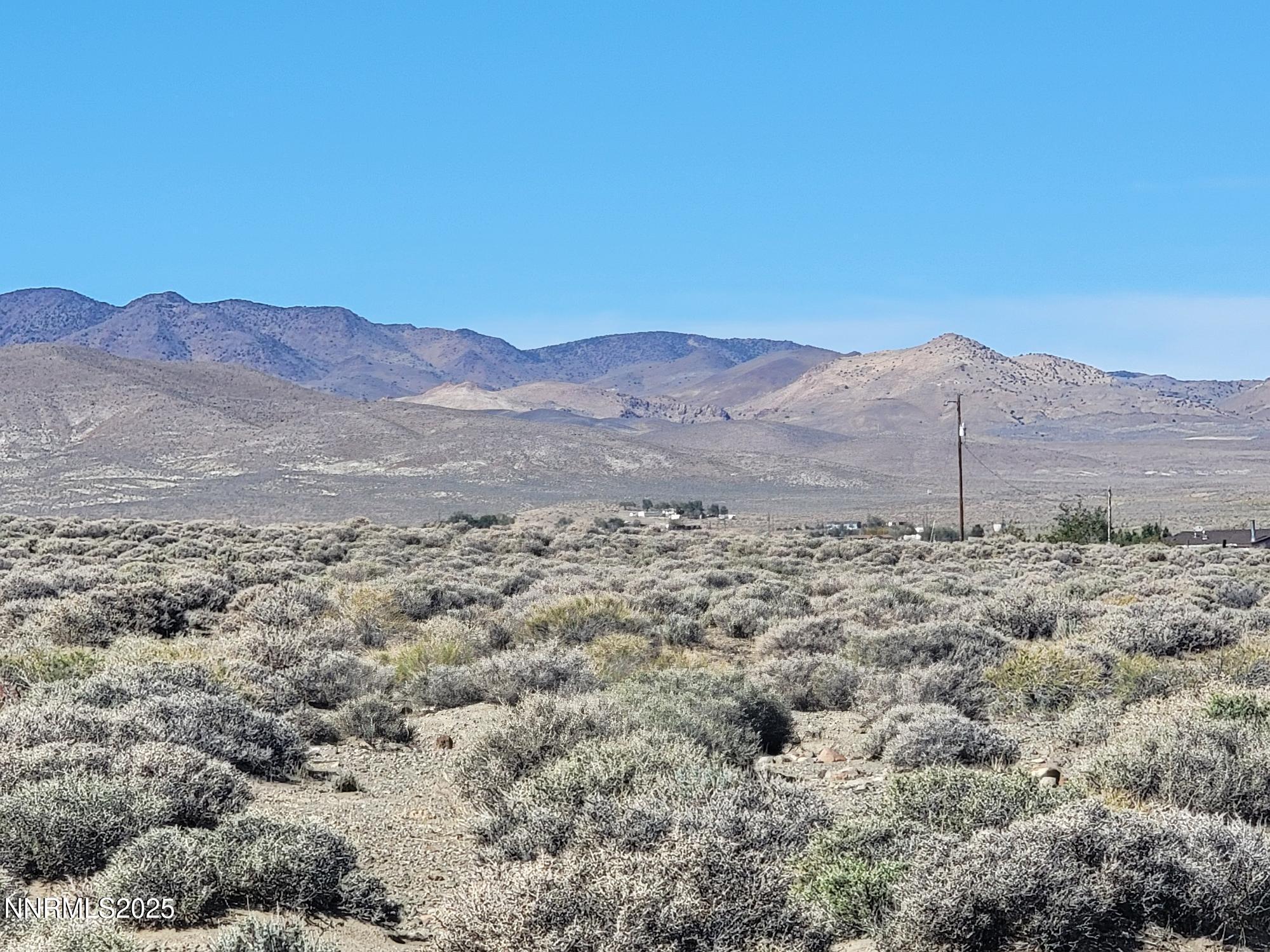 3090 Curtis Avenue Silver Springs, NV 89429 - Photo 6 of 17 a view of a backyard with green space