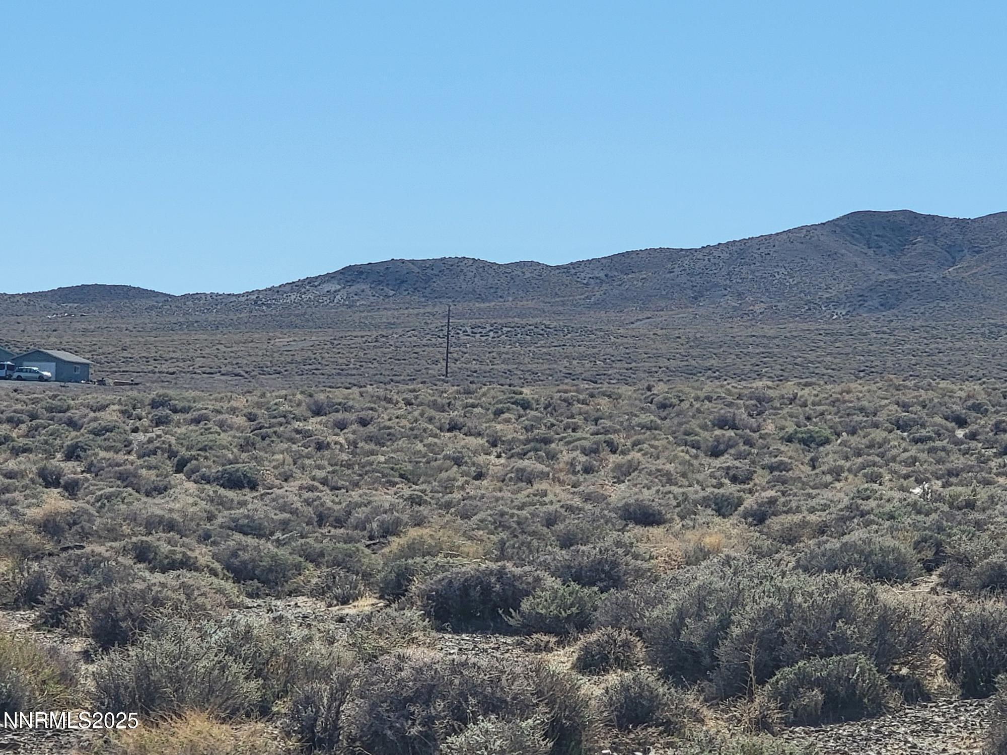 3090 Curtis Avenue Silver Springs, NV 89429 - Photo 8 of 17 a view of a large mountain with a mountain in the background