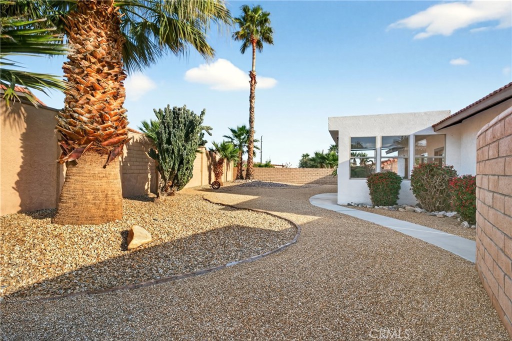 9640 Hoylake Road Desert Hot Springs, CA 92240 - Photo 31 of 46 a view of a backyard of the house