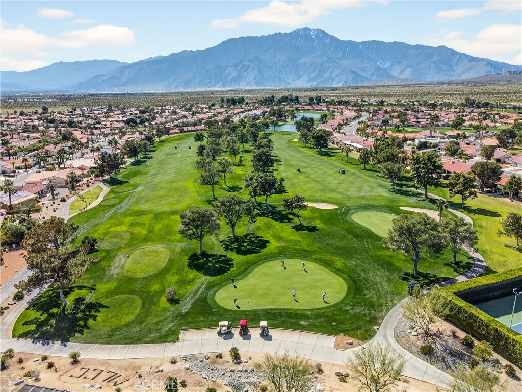 9640 Hoylake Road Desert Hot Springs, CA 92240 - Photo 44 of 46 a view of a lush green hillside and a houses