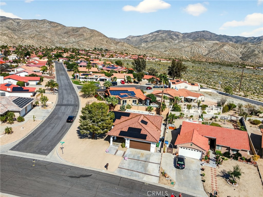 9640 Hoylake Road Desert Hot Springs, CA 92240 - Photo 46 of 46 an aerial view of residential houses with outdoor space