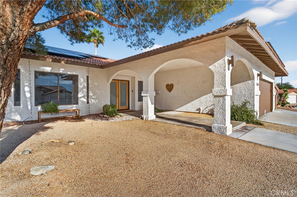 9640 Hoylake Road Desert Hot Springs, CA 92240 - Photo 5 of 46 a view of a house with a patio