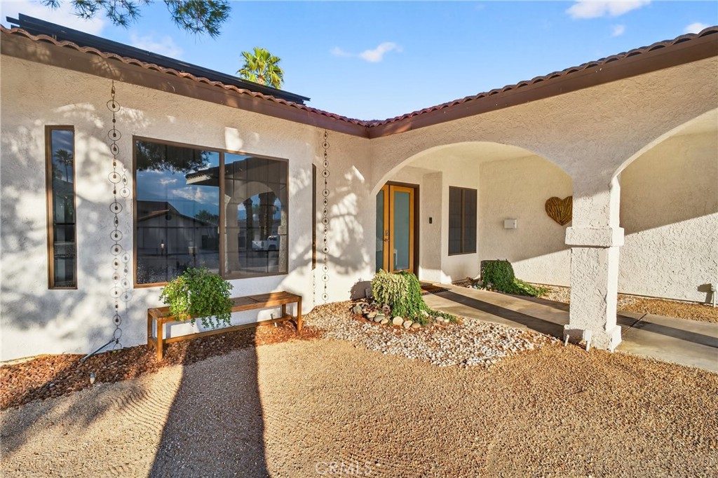 9640 Hoylake Road Desert Hot Springs, CA 92240 - Photo 6 of 46 a front view of a house