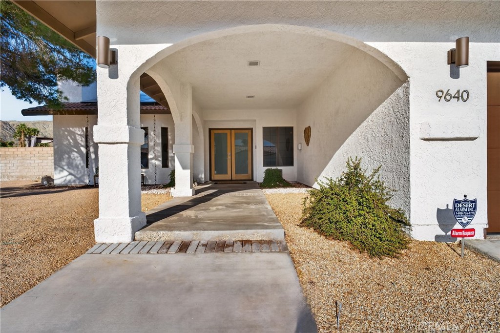 9640 Hoylake Road Desert Hot Springs, CA 92240 - Photo 7 of 46 a view of a white house