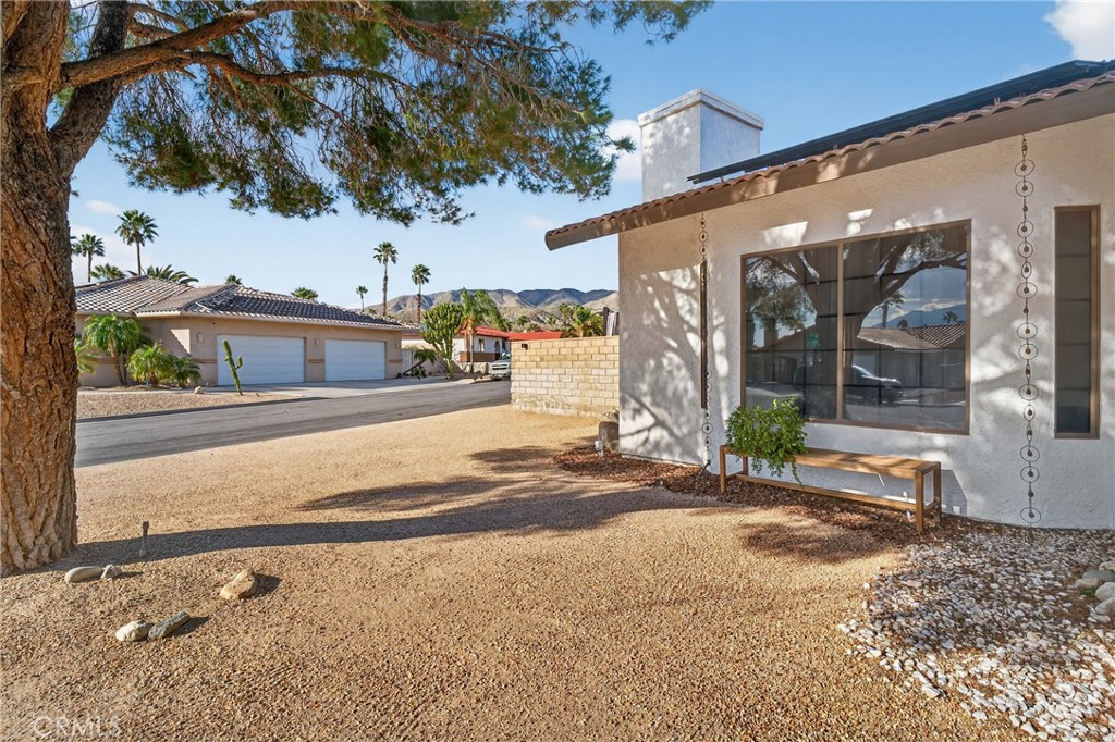 9640 Hoylake Road Desert Hot Springs, CA 92240 - Photo 9 of 46 a front view of a house