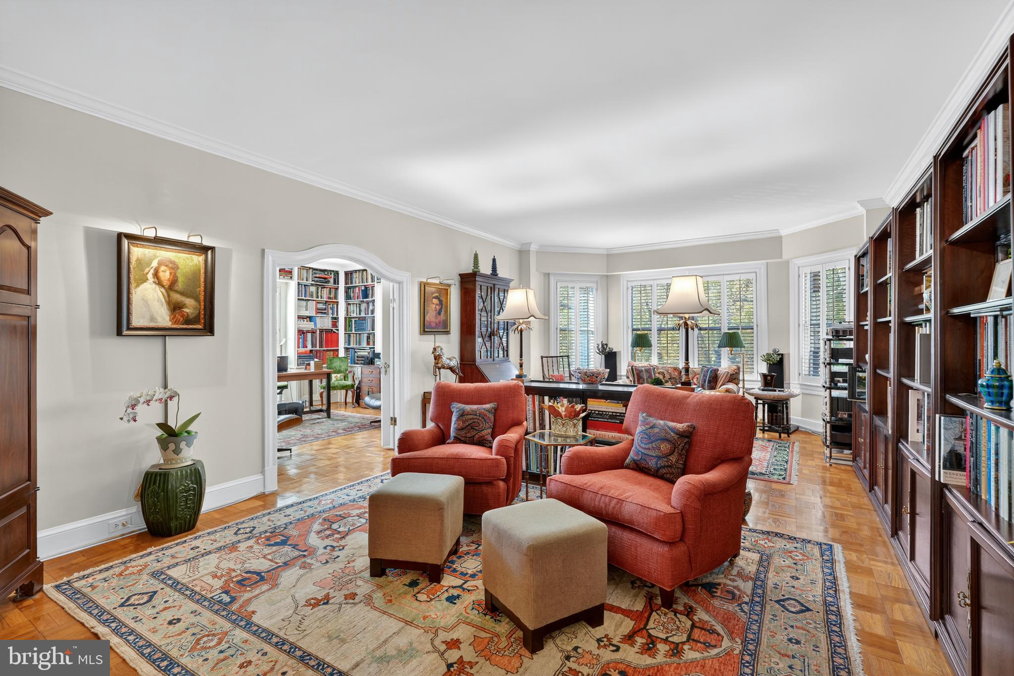 4000 Cathedral Avenue Northwest, Unit 17B Washington, DC 20016 - Photo 15 of 35 a living room with furniture a bookshelf and a window