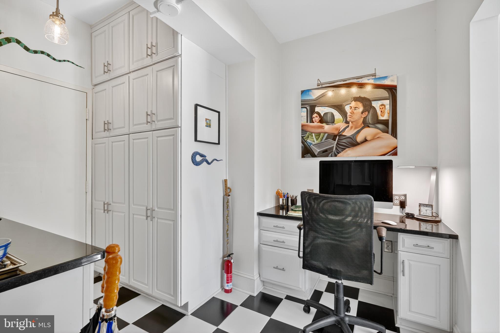 4000 Cathedral Avenue Northwest, Unit 17B Washington, DC 20016 - Photo 9 of 35 a work place with computer on desk and chair