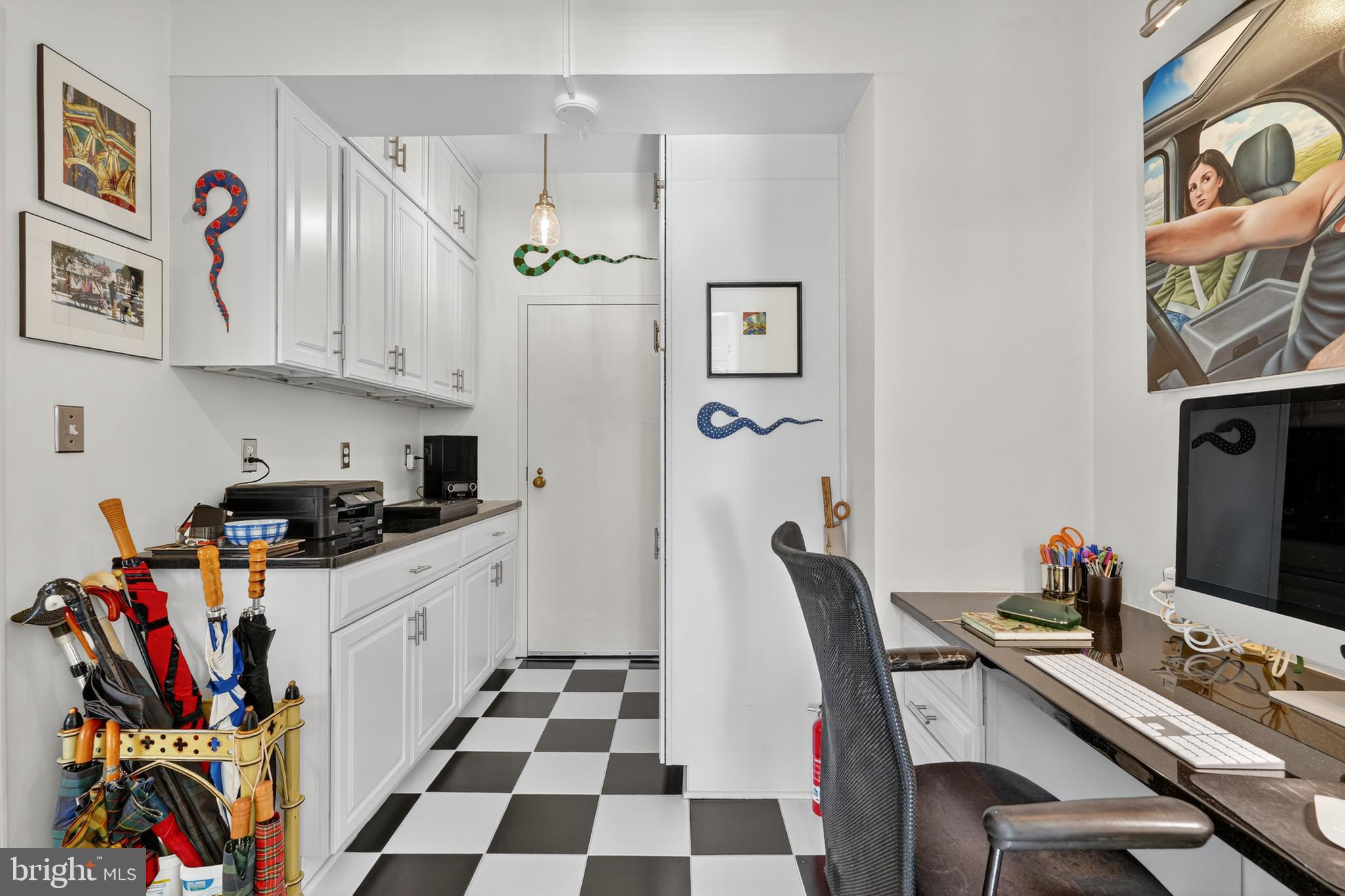 4000 Cathedral Avenue Northwest, Unit 17B Washington, DC 20016 - Photo 10 of 35 a kitchen with stainless steel appliances a stove a sink and a refrigerator