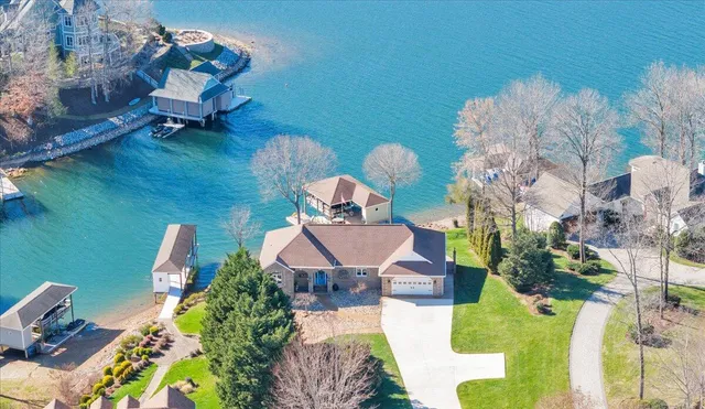 an aerial view of a house with a garden and swimming pool