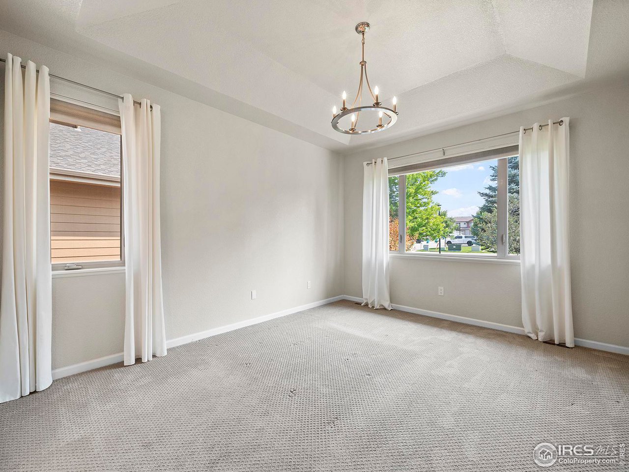 6427 Half Moon Bay Drive Windsor, CO 80550 - Photo 14 of 33 a view of an empty room with a window