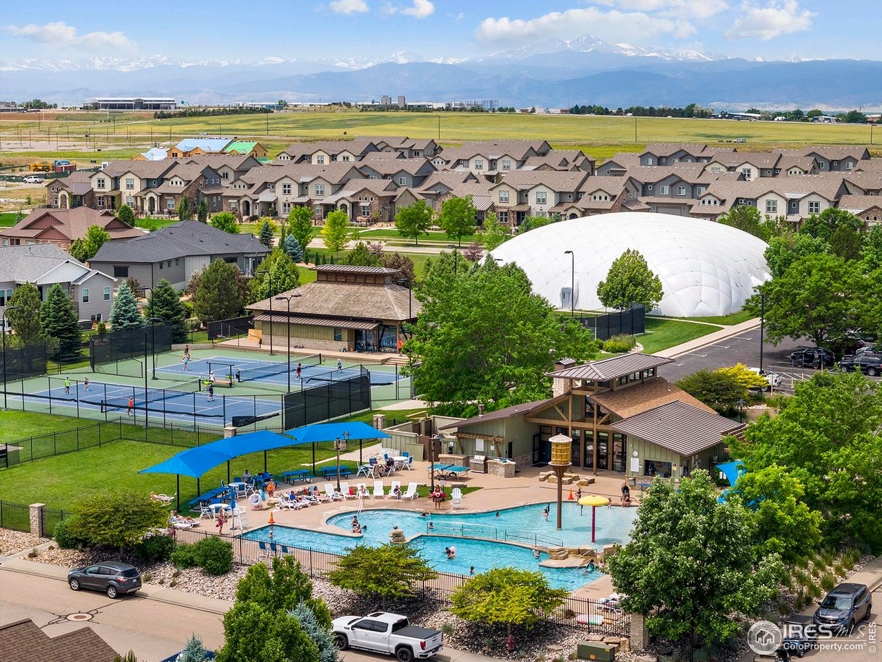 6427 Half Moon Bay Drive Windsor, CO 80550 - Photo 28 of 33 an aerial view of a house with a swimming pool yard and outdoor seating