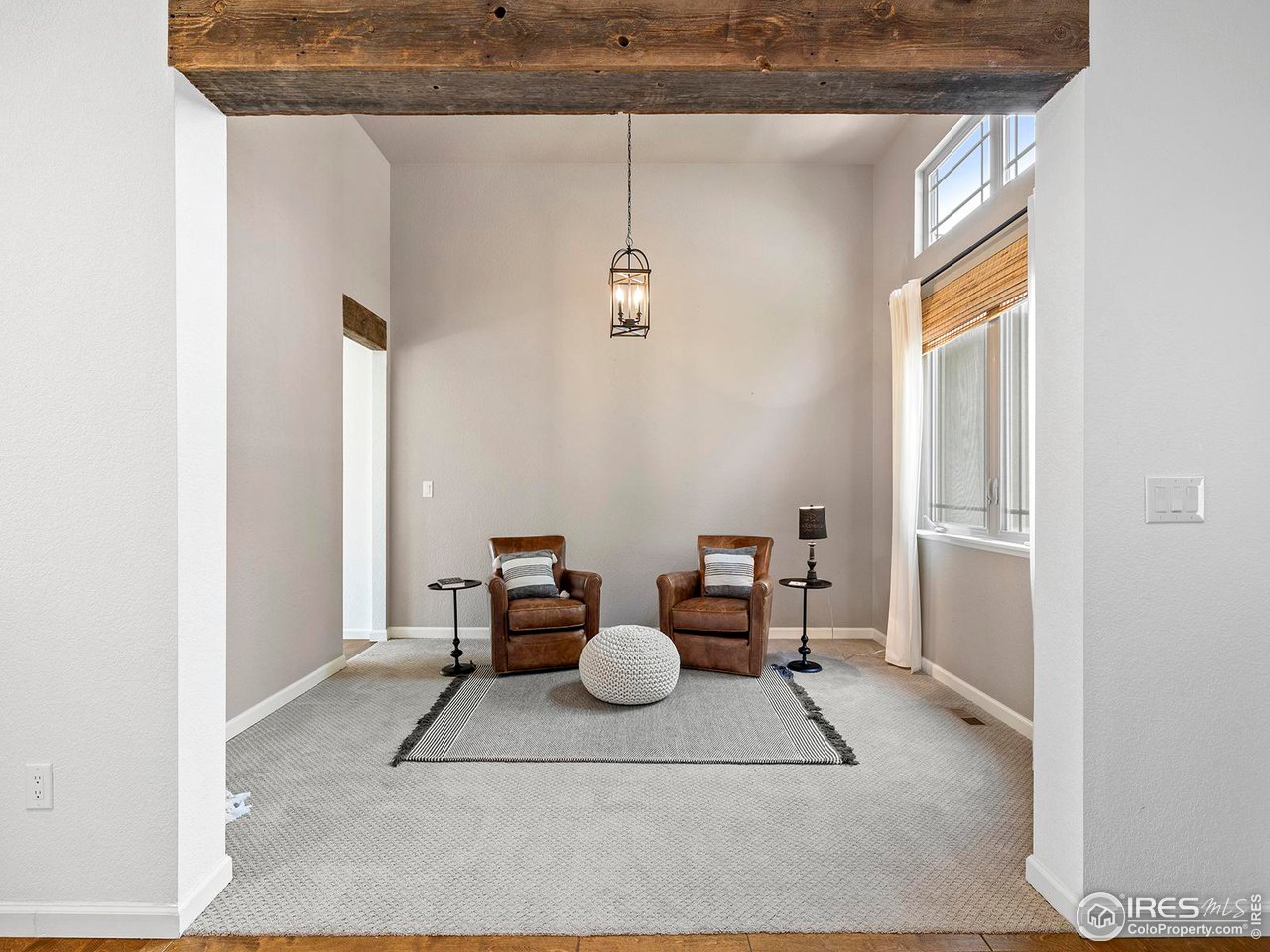 6427 Half Moon Bay Drive Windsor, CO 80550 - Photo 10 of 33 a view of living room with furniture and window