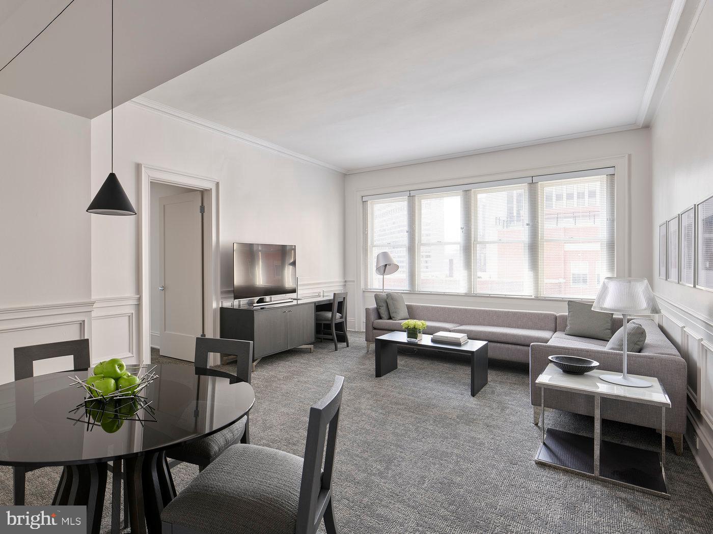 135 South 18th Street, Unit PLATINUM2BED Philadelphia, PA 19103 - Photo 2 of 12 a living room with furniture and a window