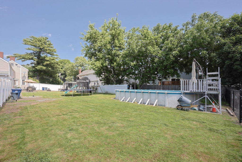 137 High Street Danvers, MA 01923 - Photo 11 of 31 a view of a house with pool and a yard