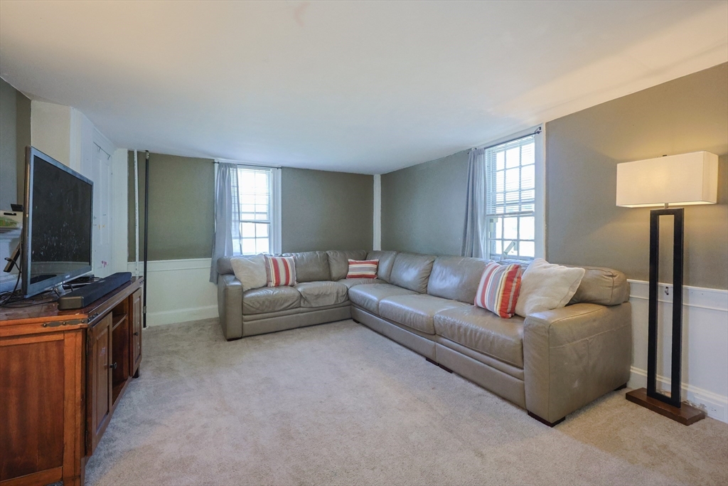 137 High Street Danvers, MA 01923 - Photo 15 of 31 a living room with furniture and a flat screen tv