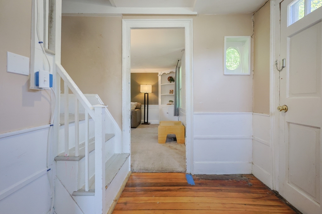 137 High Street Danvers, MA 01923 - Photo 17 of 31 a view of a hallway view with wooden floor and staircase