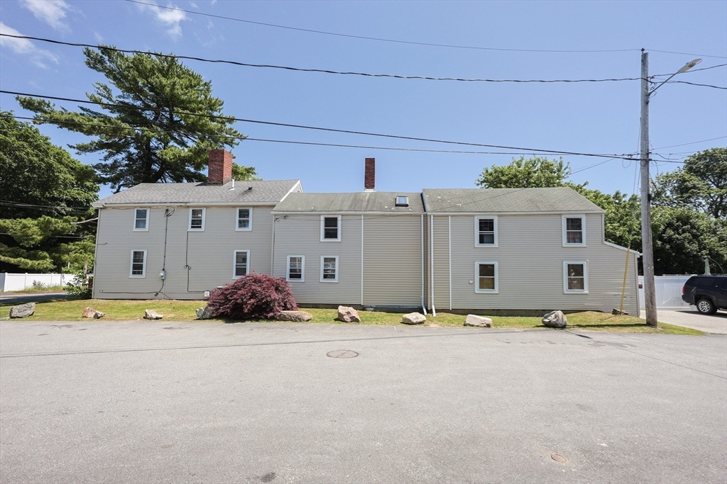 137 High Street Danvers, MA 01923 - Photo 26 of 31 a view of a house with backyard and sitting area