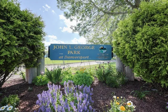 a view of a house with a yard and trees