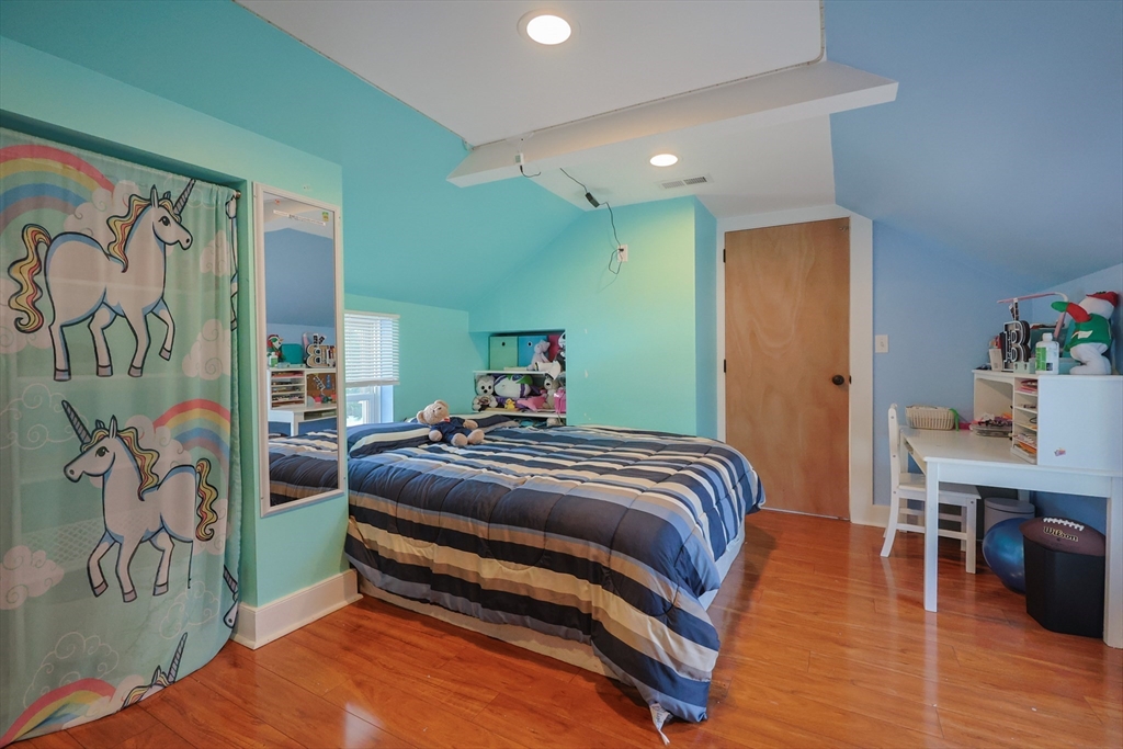 137 High Street Danvers, MA 01923 - Photo 8 of 31 a bedroom with a bed and a table