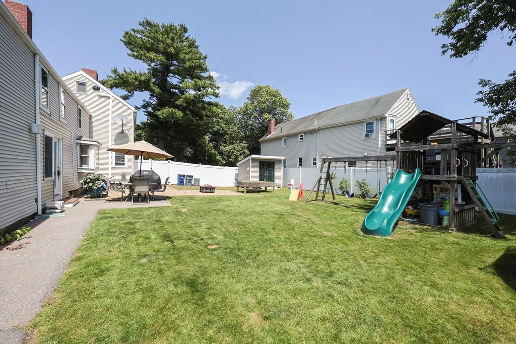 137 High Street Danvers, MA 01923 - Photo 10 of 31 a view of a house with a yard porch and a slide