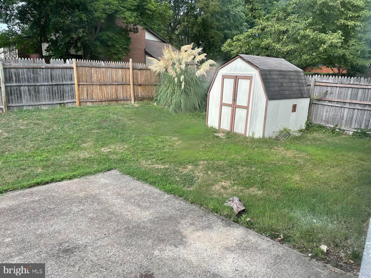 9129 Tulip Grove Road Gaithersburg, MD 20879 - Photo 11 of 12 Charming backyard with a quaint shed.