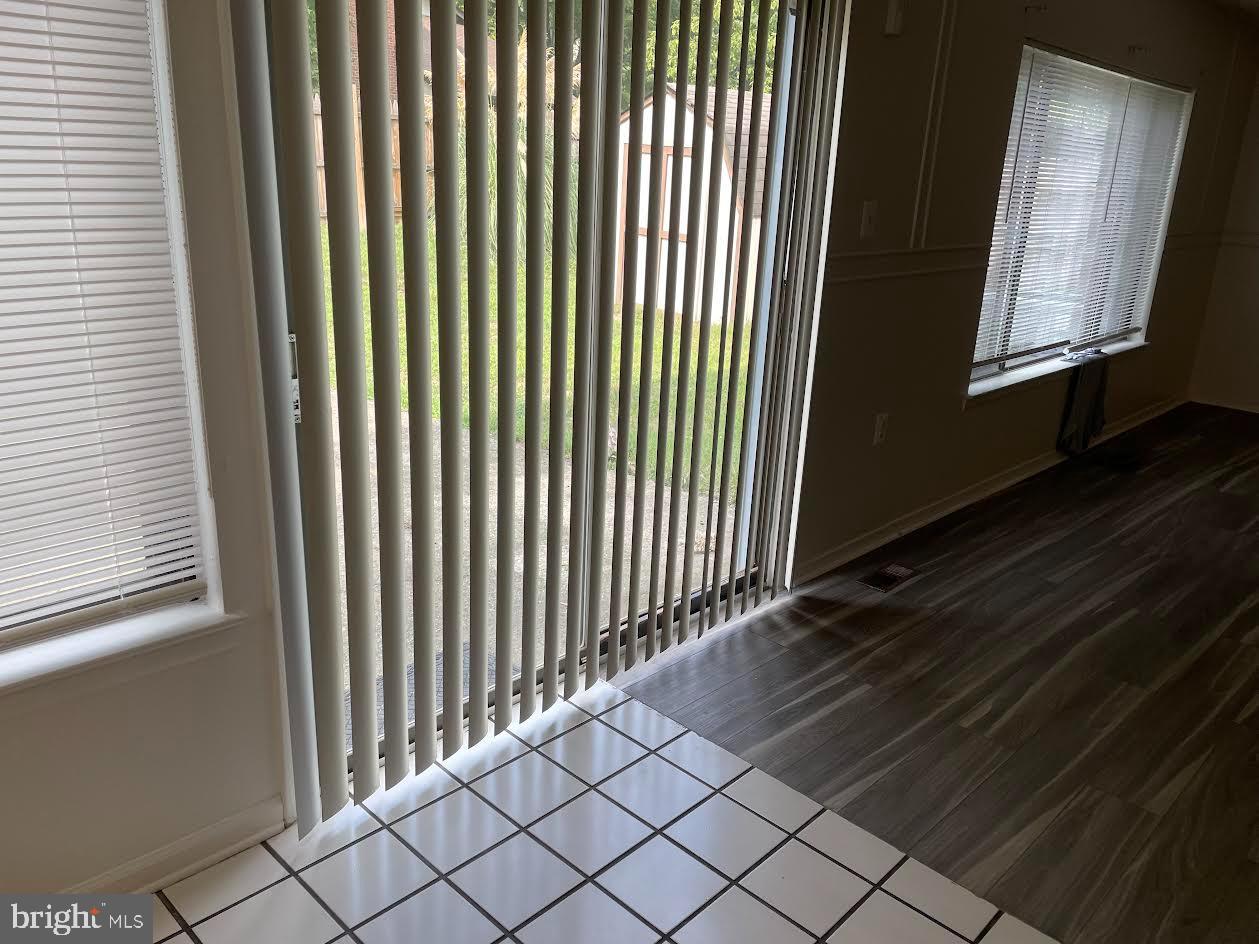 9129 Tulip Grove Road Gaithersburg, MD 20879 - Photo 8 of 12 Bright indoor space with sliding doors.