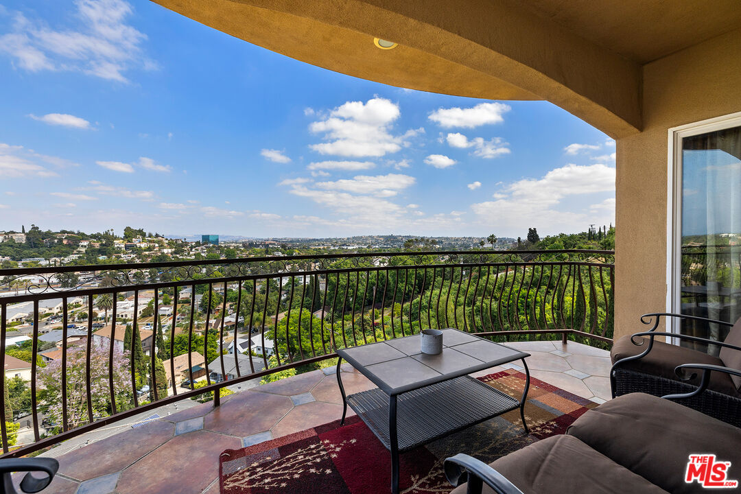 4230 Barrett Road Los Angeles, CA 90032 - Photo 1 of 28 a view of a balcony with lake view and a potted plant