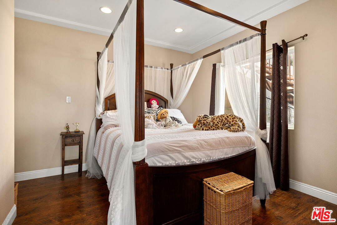 4230 Barrett Road Los Angeles, CA 90032 - Photo 13 of 28 a bedroom with a bed and a dresser