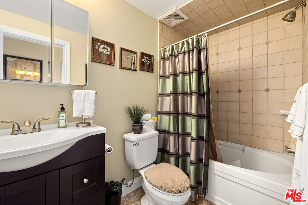 4230 Barrett Road Los Angeles, CA 90032 - Photo 16 of 28 a bathroom with a sink a toilet and shower