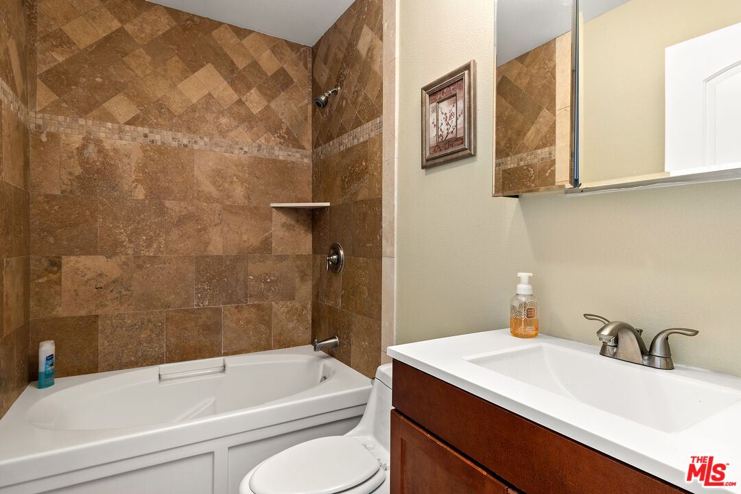 4230 Barrett Road Los Angeles, CA 90032 - Photo 19 of 28 a bathroom with a sink and a bathtub