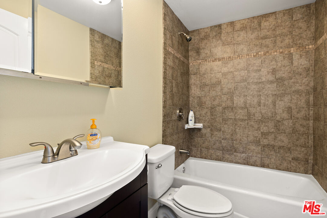 4230 Barrett Road Los Angeles, CA 90032 - Photo 20 of 28 a bathroom with a sink a toilet and bathtub