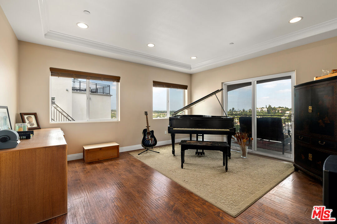4230 Barrett Road Los Angeles, CA 90032 - Photo 21 of 28 a living room with furniture a piano and a flat screen tv
