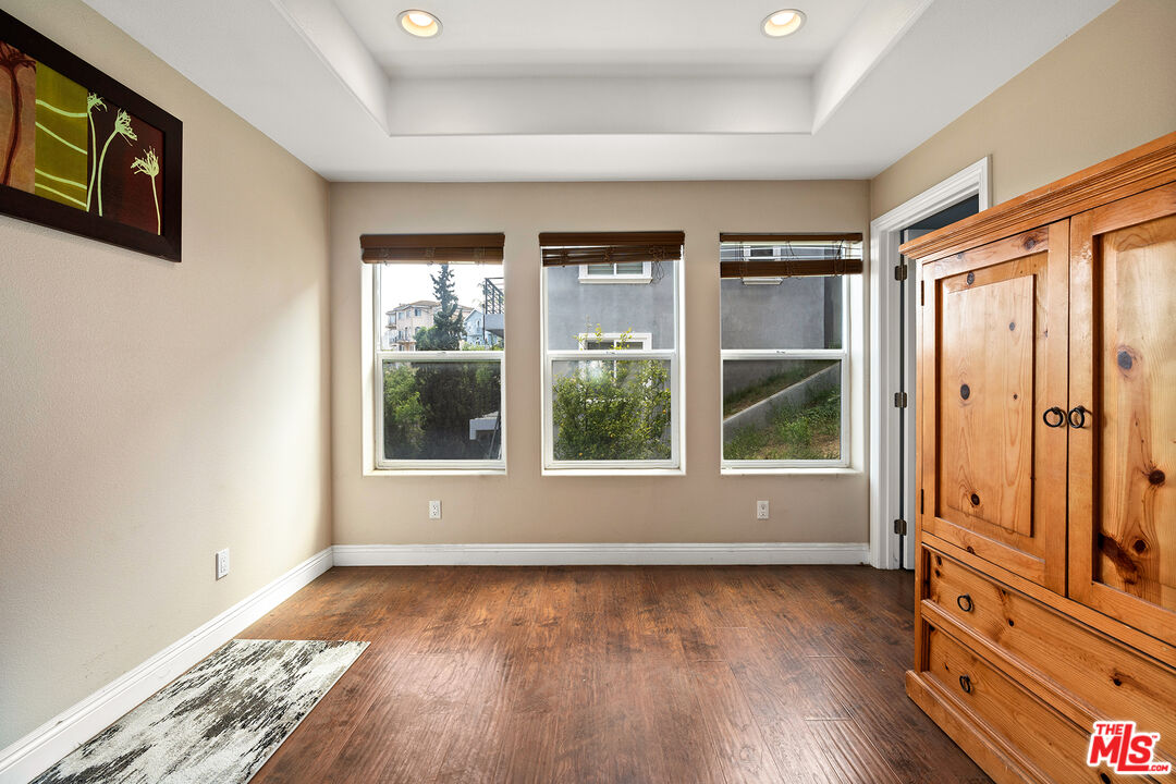 4230 Barrett Road Los Angeles, CA 90032 - Photo 24 of 28 an empty room with wooden floor and windows