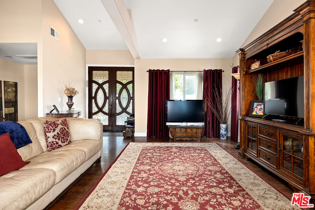 4230 Barrett Road Los Angeles, CA 90032 - Photo 3 of 28 a living room with furniture and a flat screen tv