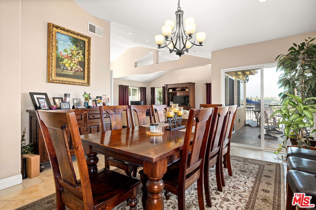 4230 Barrett Road Los Angeles, CA 90032 - Photo 6 of 28 a view of a dining room with furniture and chandelier