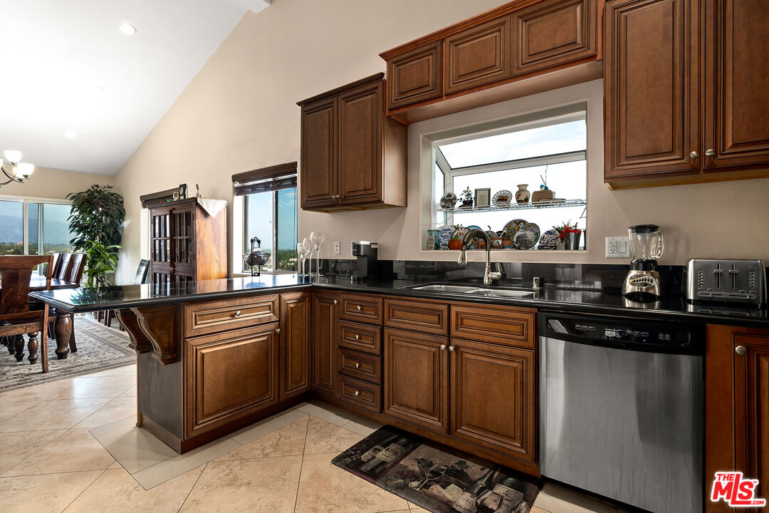 4230 Barrett Road Los Angeles, CA 90032 - Photo 8 of 28 a kitchen with stainless steel appliances granite countertop a sink and cabinets
