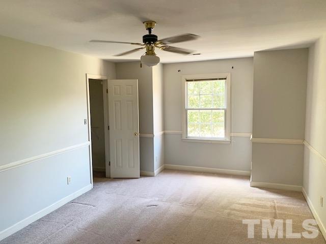 4529 Birmingham Way Raleigh, NC 27604 - Photo 14 of 26 Spacious second floor master suite easily fits a king sized bed and features a ceiling fan and chair rail moldings.