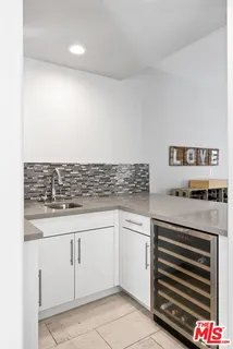 a bathroom with a granite countertop double vanity sink toilet and shower