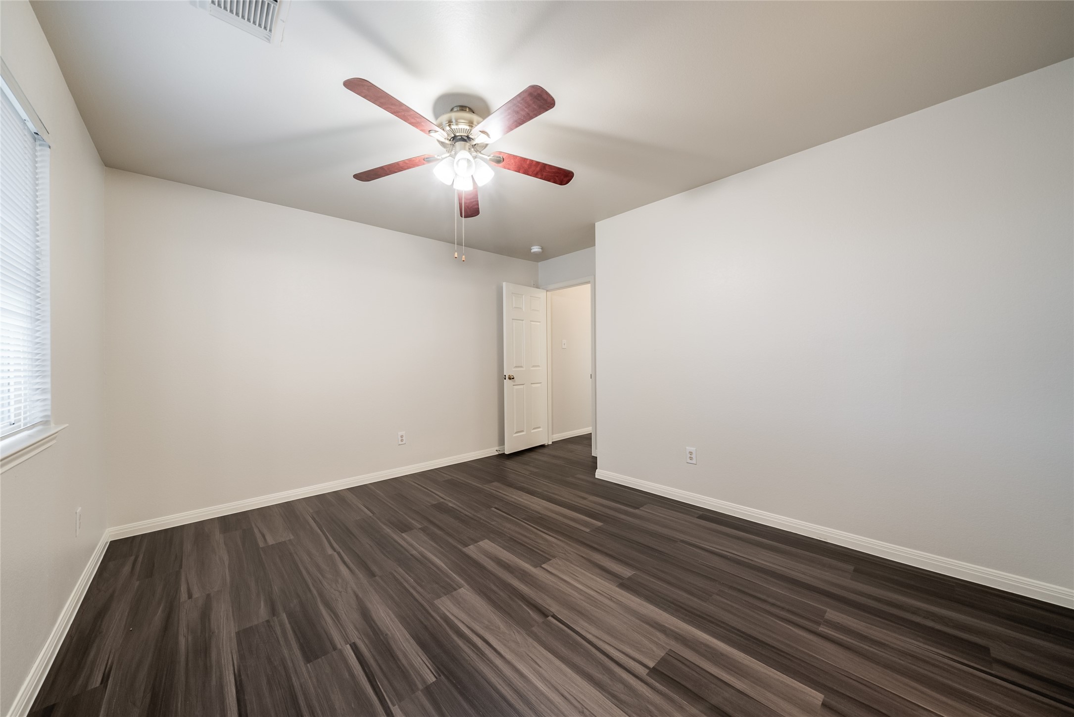 915 Double File Trail Round Rock, TX 78665 - Photo 21 of 32 a view of an empty room with wooden floor