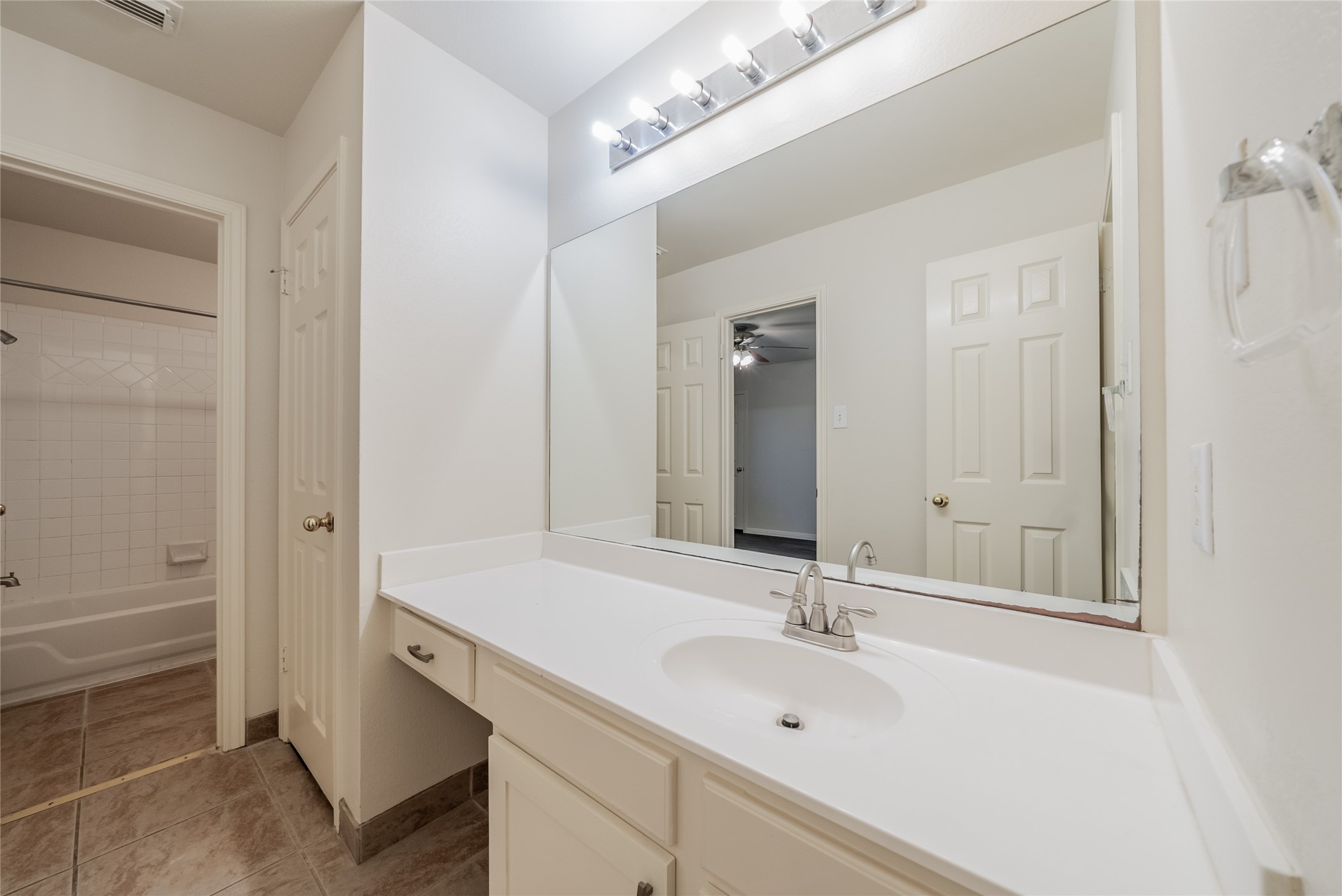 915 Double File Trail Round Rock, TX 78665 - Photo 23 of 32 a bathroom with a sink and a mirror
