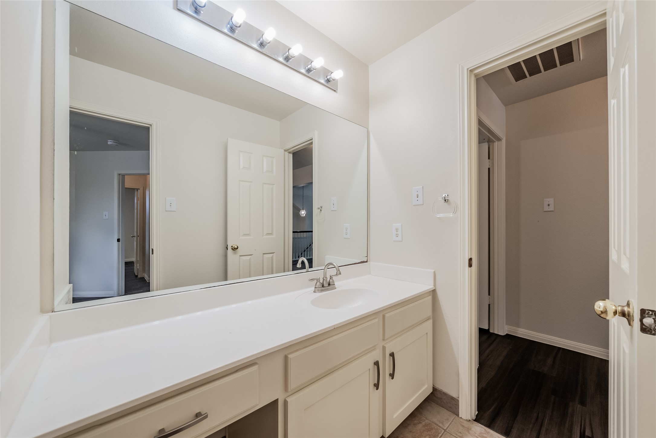 915 Double File Trail Round Rock, TX 78665 - Photo 24 of 32 a bathroom with a sink vanity and a mirror