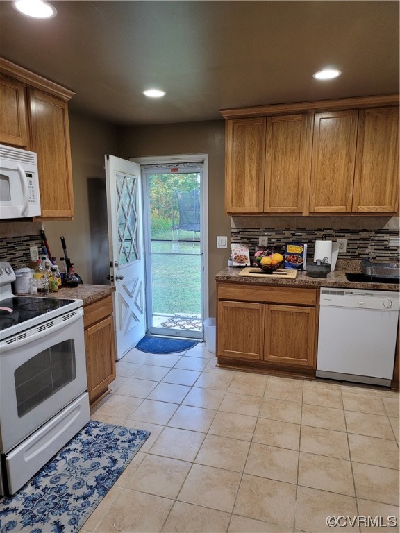 15230 McBryant Road Ruther Glen, VA 22546 - Photo 9 of 22 a kitchen with a stove a sink a refrigerator and cabinets