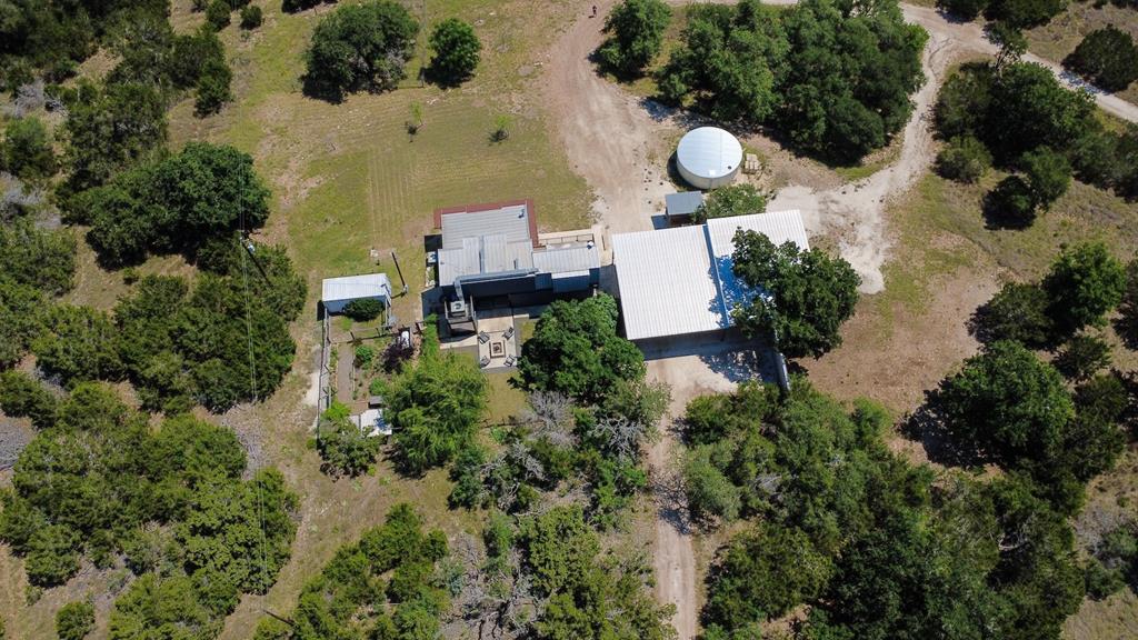 232 Spring Road Fredericksburg, TX 78624 - Photo 2 of 58 an aerial view of house with yard and outdoor seating