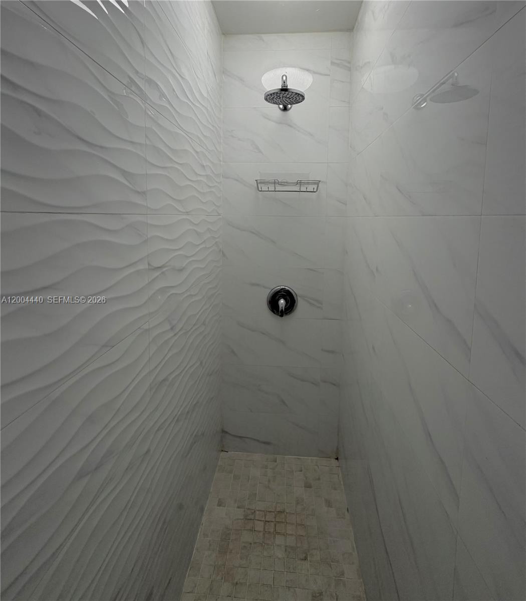 5801 Northwest 113th Terrace, Unit 4 Hialeah, FL 33012 - Photo 8 of 8 a bathroom with a shower